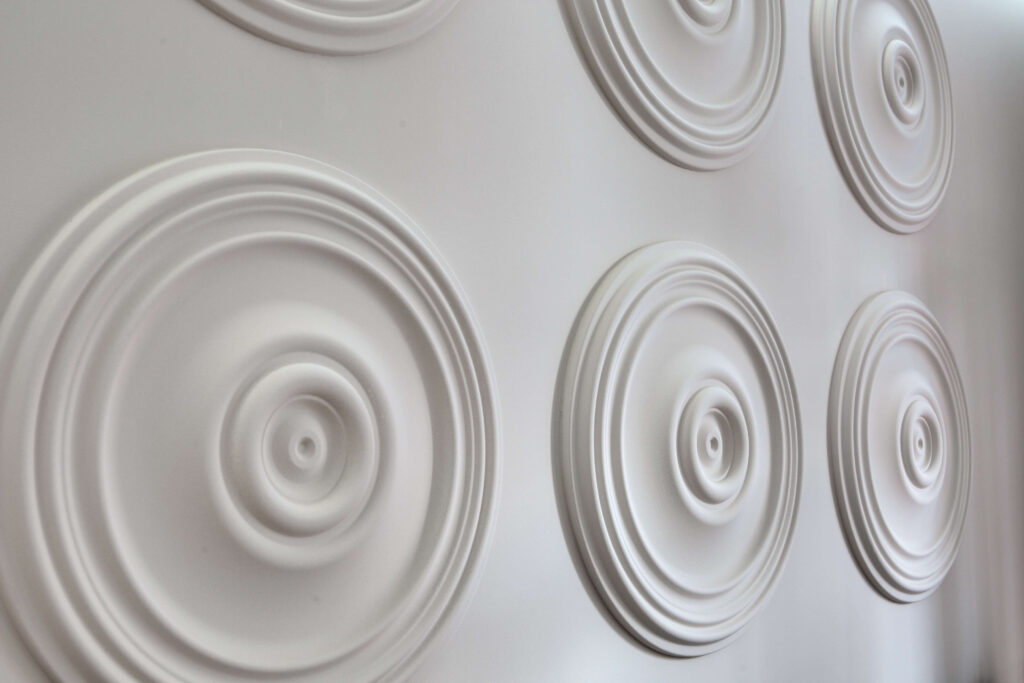B3025 Mardom Decor white decorative ceiling rosettes mounted side by side in a wall arrangement