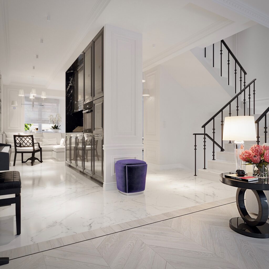 Salon i przestrzeń schodowa w stylu francuskim — marmur, biel, czerń i dekoracyjna sztukateria