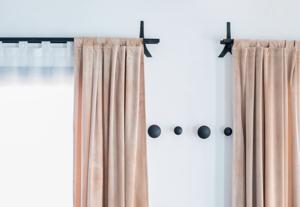 Black apartment curtain rods, rod mounted to the wall